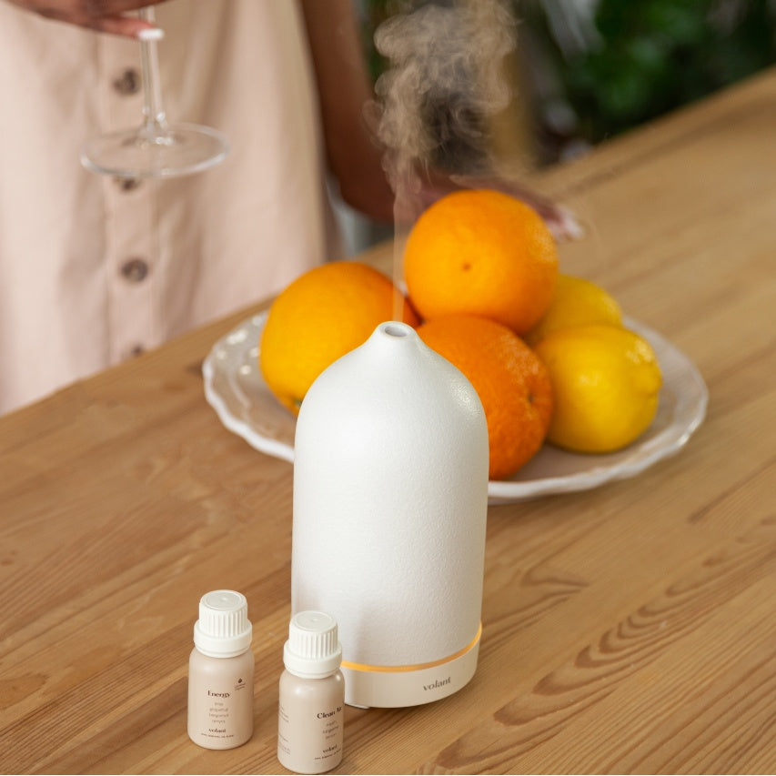 volant white diffuser using energy and clean air essential oil blends in the dining table