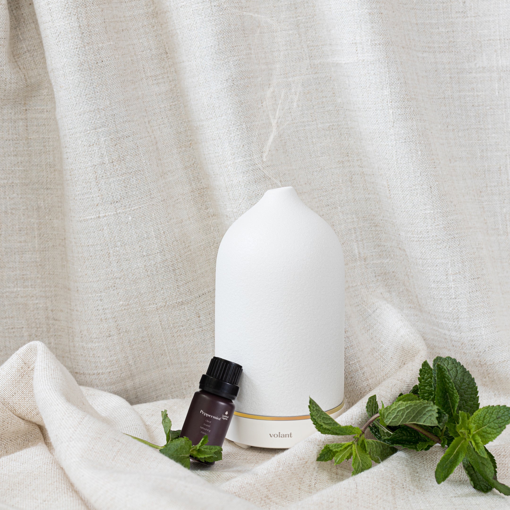 volant white diffuser using organic peppermint essential oil to keep mosquitoes away